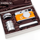 Illustration for article titled Leica M7 Hermès Camera Gets Fondled In Lavish Hands-On Unboxing